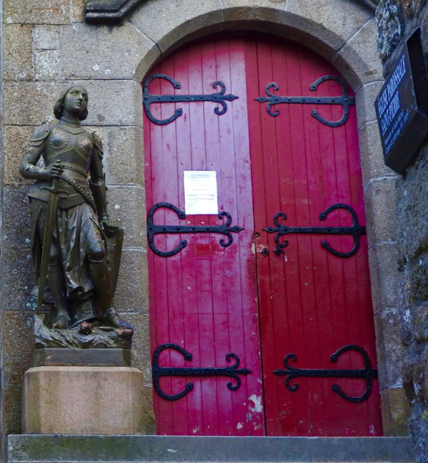 Statue of Joan of Arc, outside the Église-Saint-Pierre, the parish church at Mont-Saint-Michel.  The Archangel Michael was one of the saints who inspired Joan's mission. She was especially moved by the French defense at the siege of Mont-Saint-Michel.