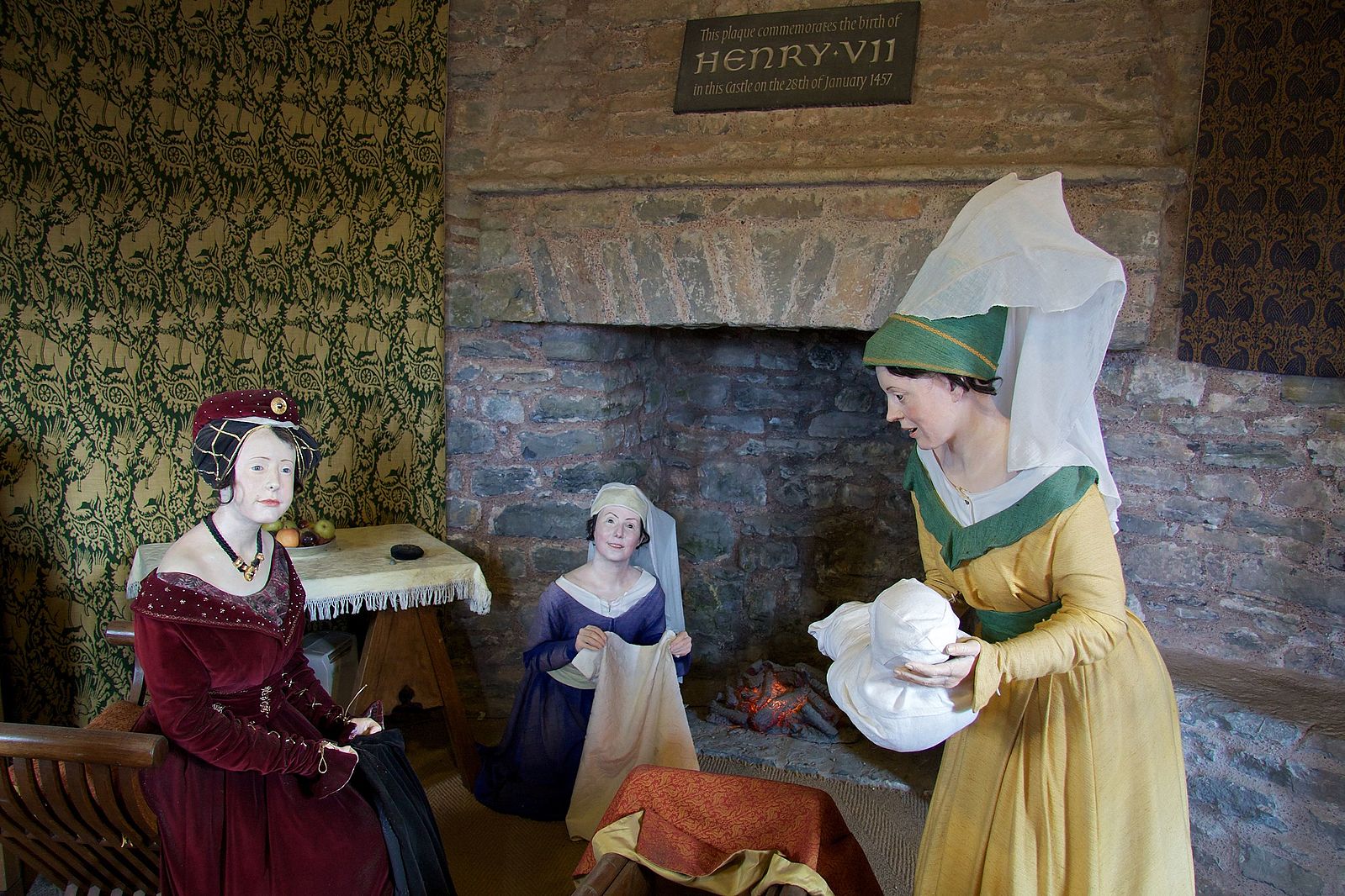 Wax figure display at Pembroke Castle, Wales, depicting Lady Margaret Beaufort, her infant son, the future Henry VII, and two attendants.