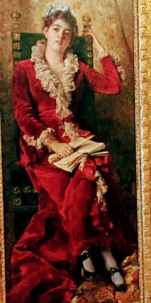 Full-length portrait of woman in red gown