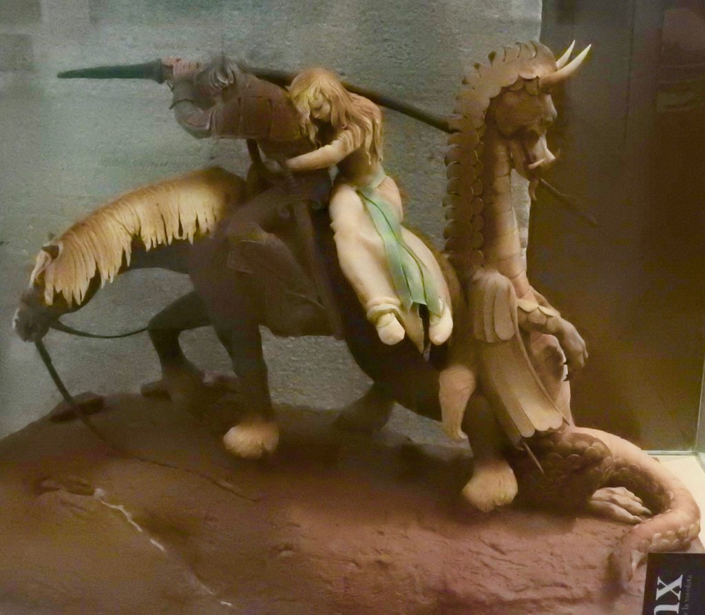 chocolate sculpture of a knight, damsel, and dead dragon