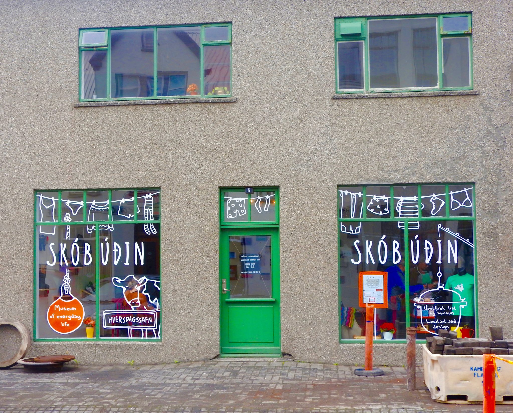 Skobudin Museum front Grey building with green shutters