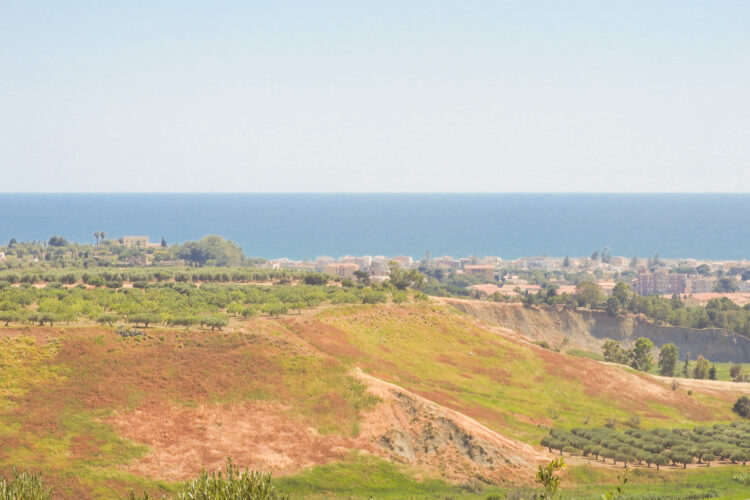 View of coastal city of Agrigento and the Mediterranean Sea from the Valley of the Temples